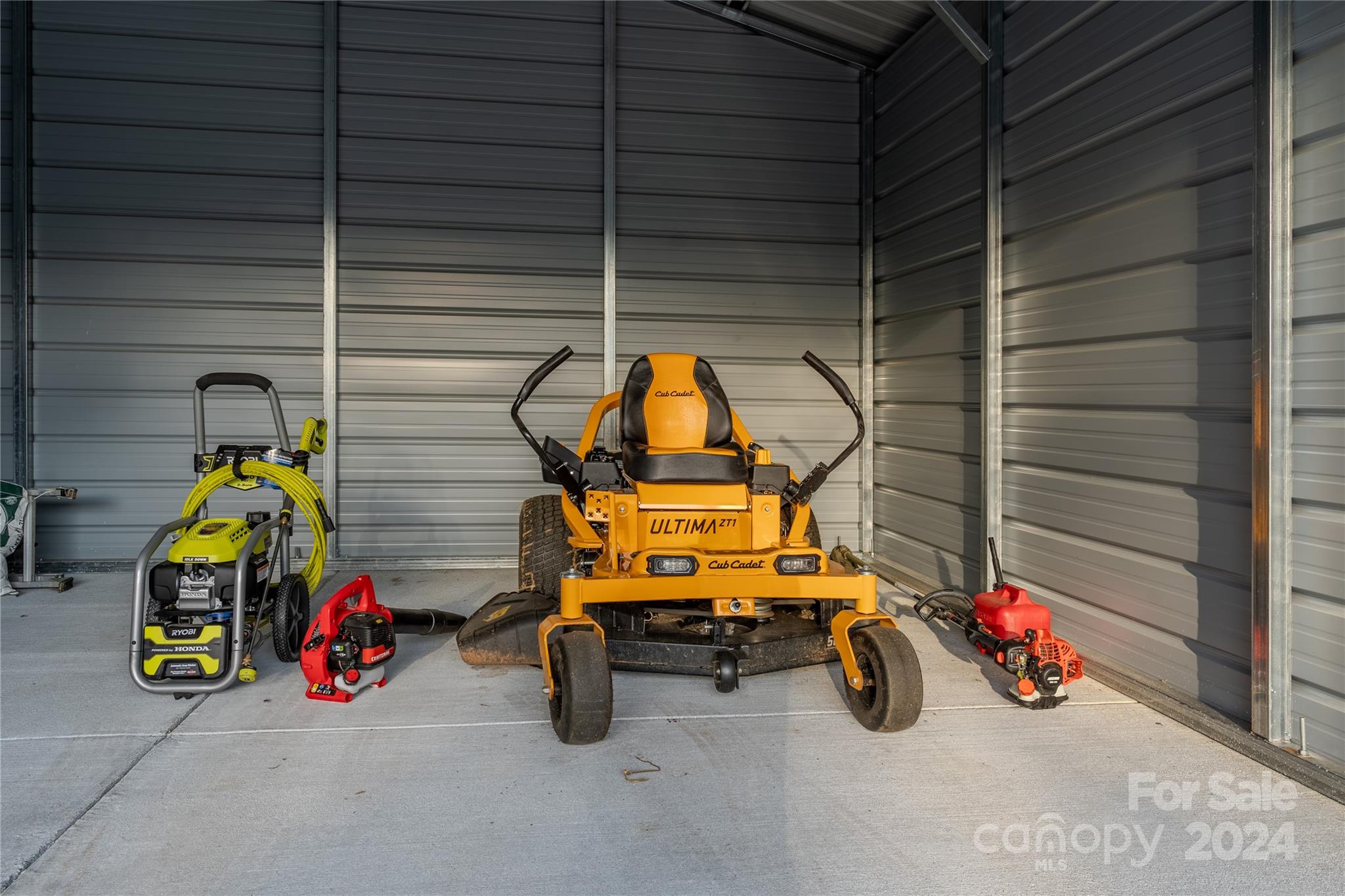 201 Potter Road Monroe, NC 28110 - Photo 36 of 44 a view of parking garage with cars and parked