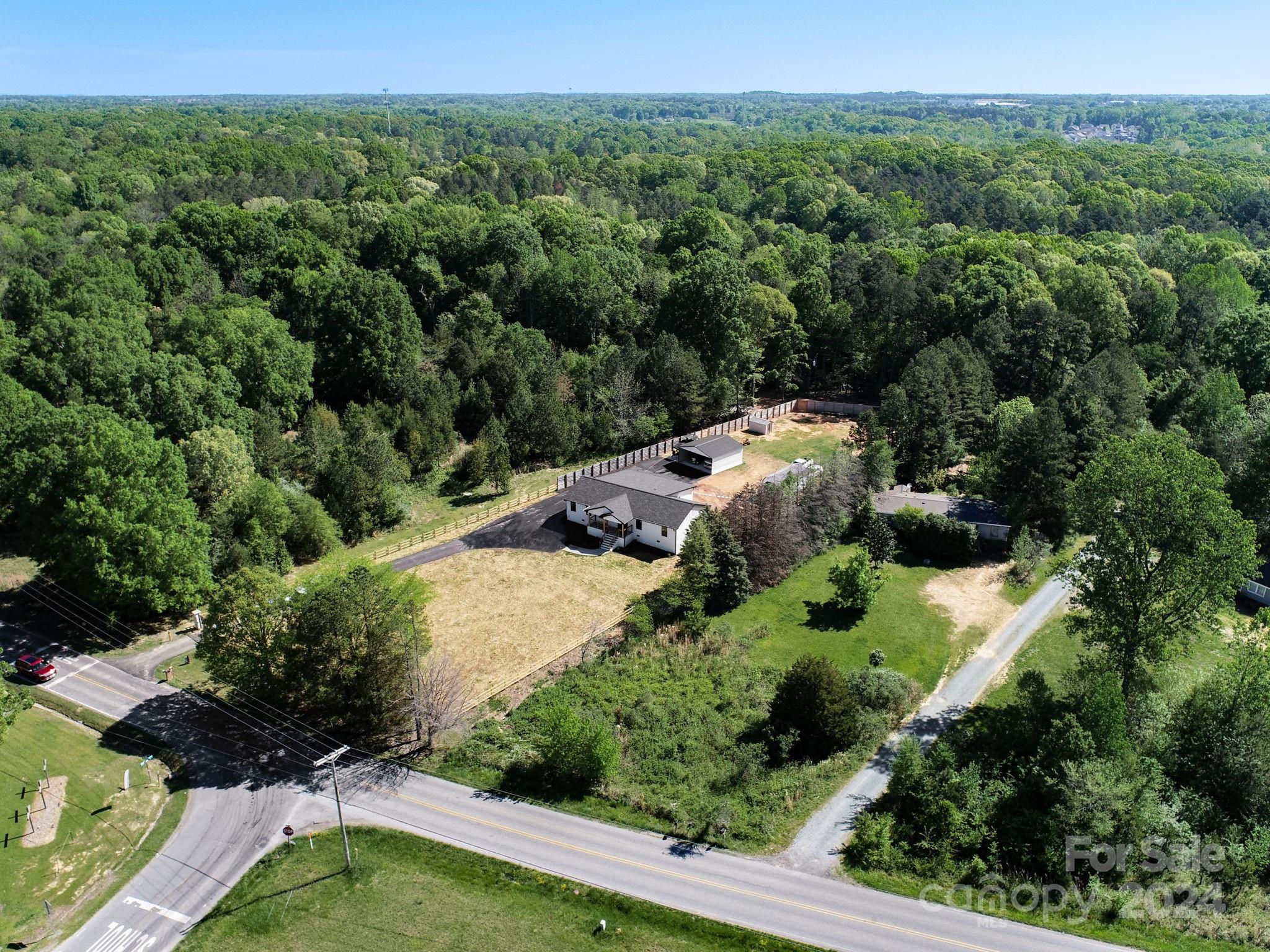 201 Potter Road Monroe, NC 28110 - Photo 41 of 44 an aerial view of a house with a yard