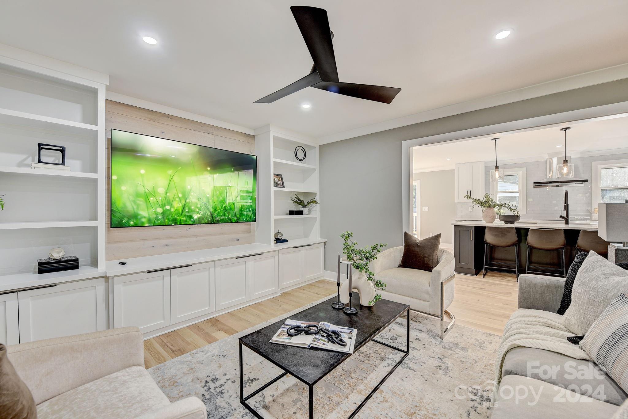 201 Potter Road Monroe, NC 28110 - Photo 7 of 44 a living room with furniture and a flat screen tv