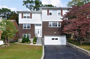 17 Ridge Road Dobbs Ferry, NY 10522 - Photo 1 of 1 a front view of a house with a yard and trees