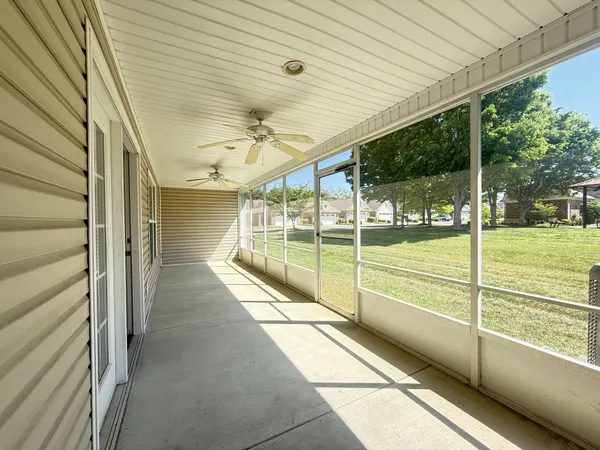 a view of a porch with wooden floor and stairs