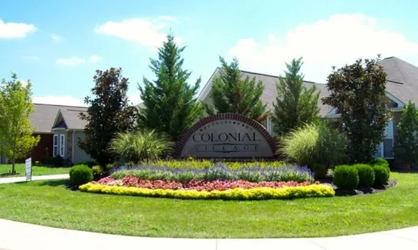 a view of a garden with a house