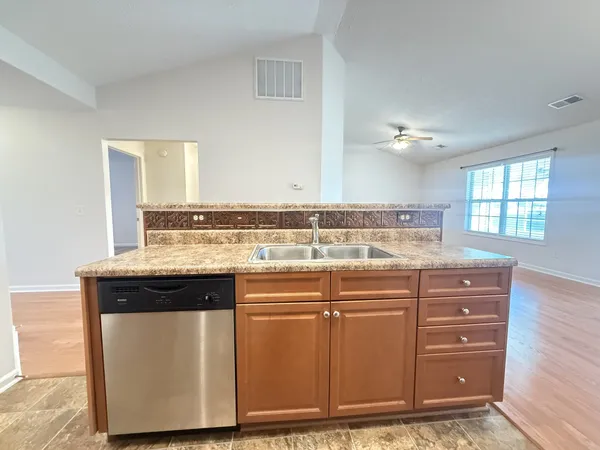 a view of cabinets with wooden floor