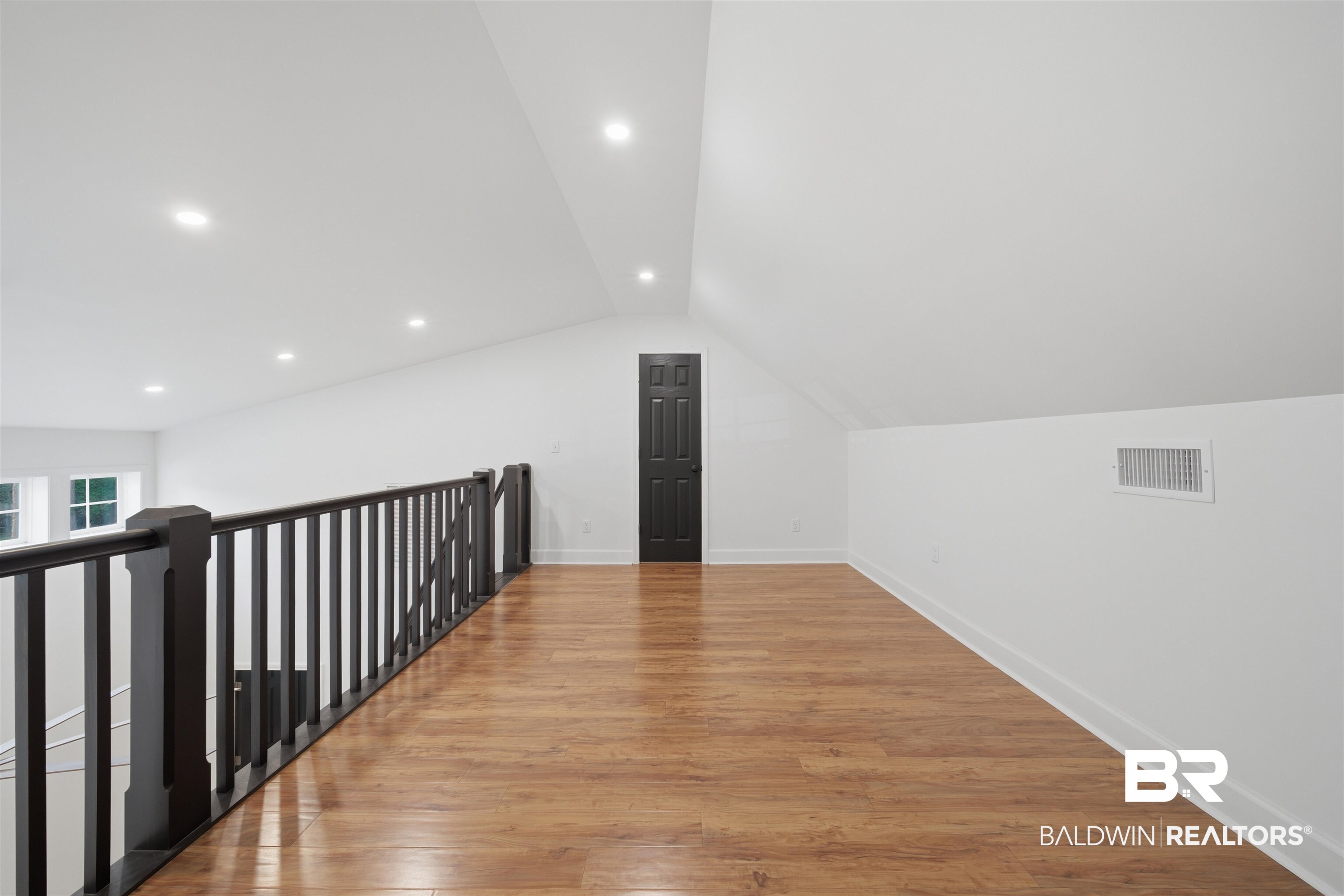 14128 Jackson Lane Foley, AL 36535 - Photo 31 of 36 Attic loft space featuring wood-finish flooring, vaulted ceilings, and recessed lighting