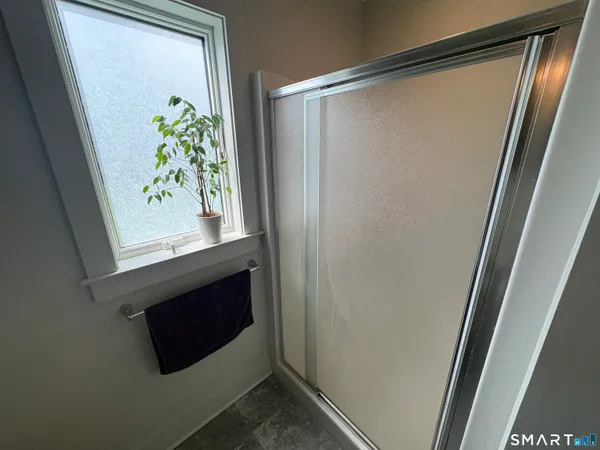 a kitchen with a table chairs sink and cabinets