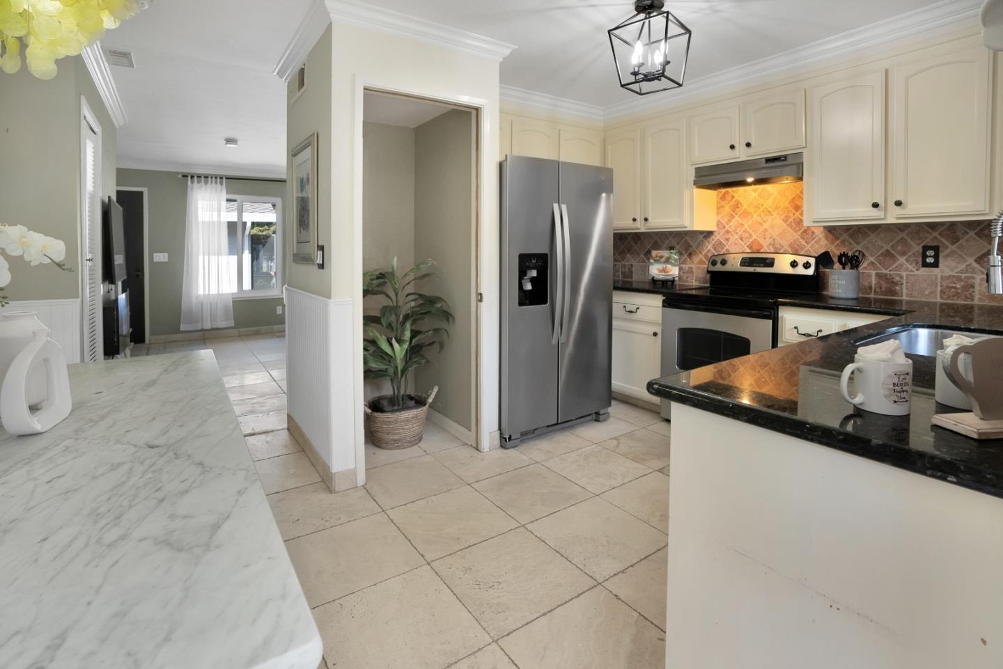 294 Bonefish Court Aptos, CA 95003 - Photo 12 of 27 a kitchen with granite countertop a refrigerator a stove and a sink