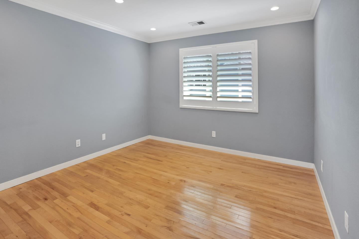 294 Bonefish Court Aptos, CA 95003 - Photo 17 of 27 a view of an empty room with wooden floor and a window