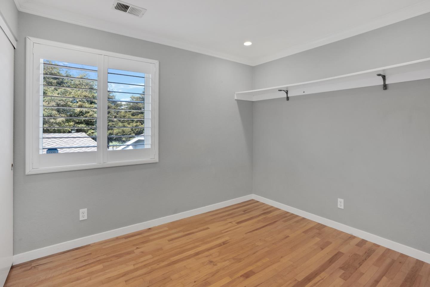 294 Bonefish Court Aptos, CA 95003 - Photo 19 of 27 a view of a room with wooden floor and fan