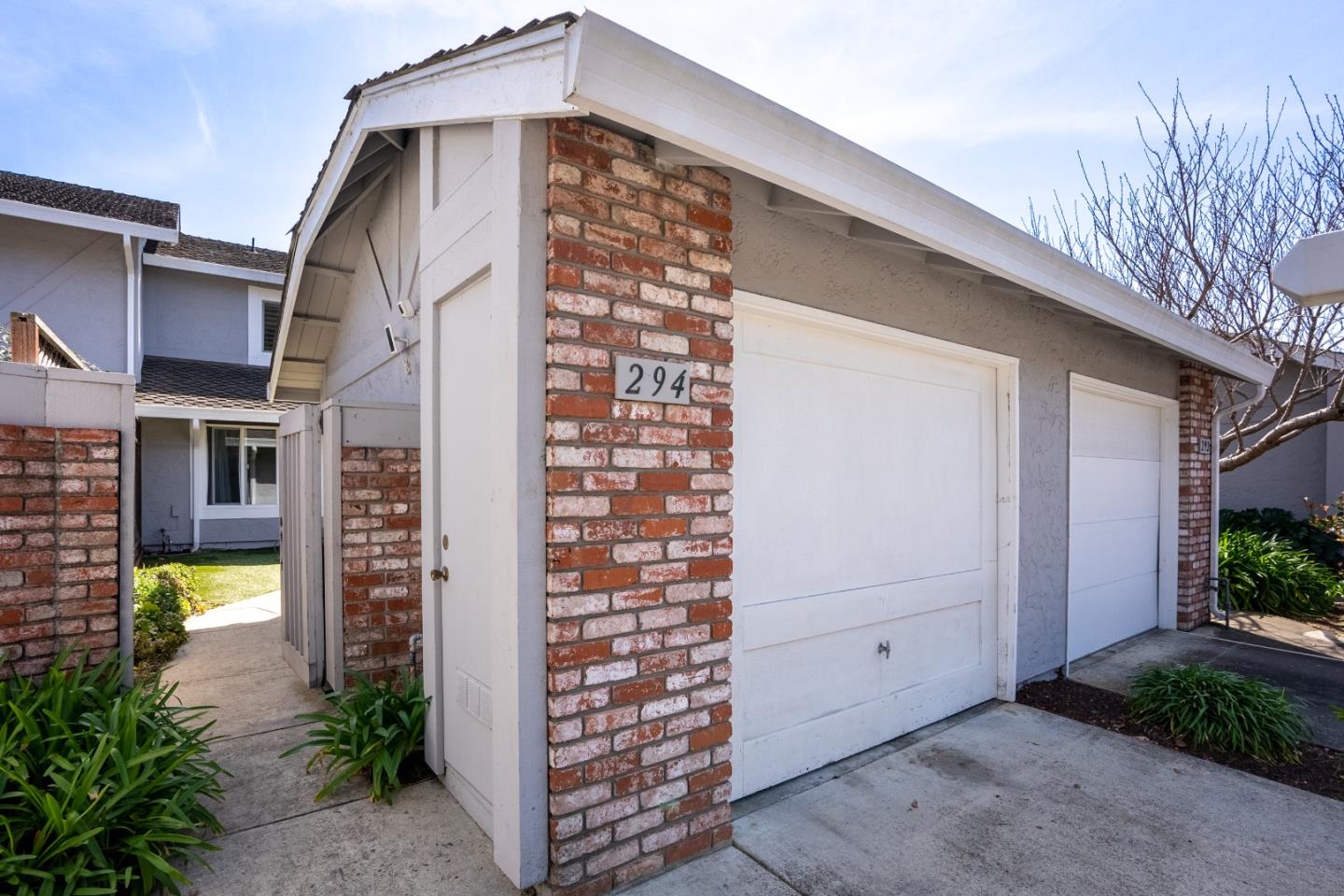 294 Bonefish Court Aptos, CA 95003 - Photo 3 of 27 a front view of a building with a plants