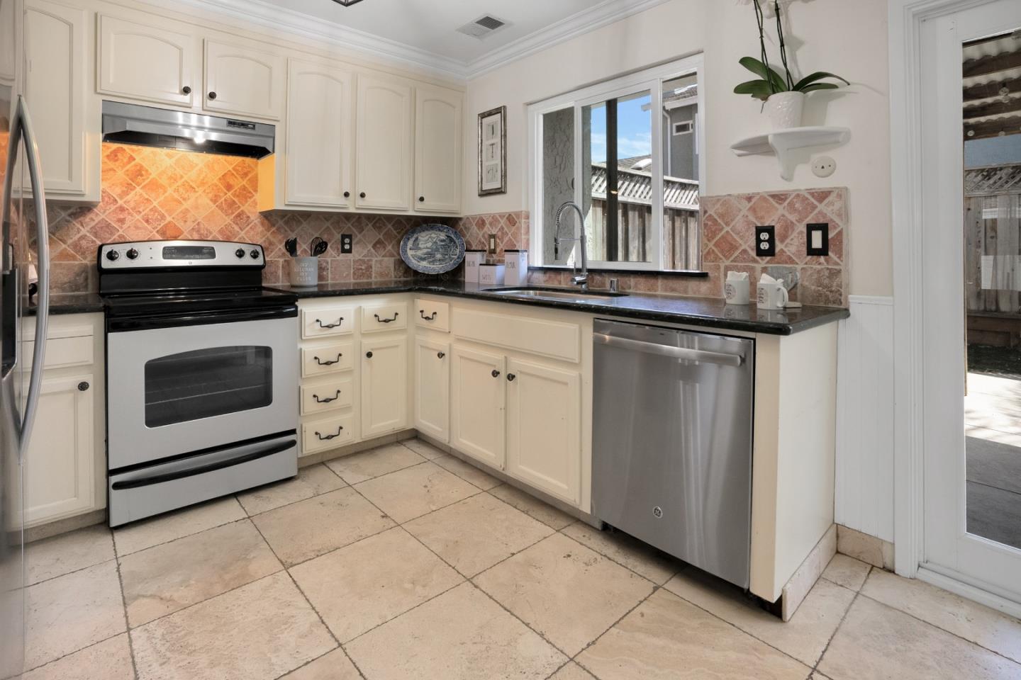 294 Bonefish Court Aptos, CA 95003 - Photo 10 of 27 a kitchen with stainless steel appliances granite countertop a stove sink and cabinets