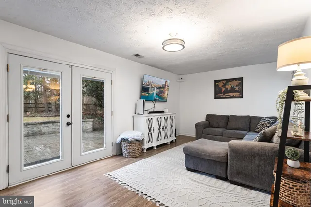 a living room with furniture and a gate