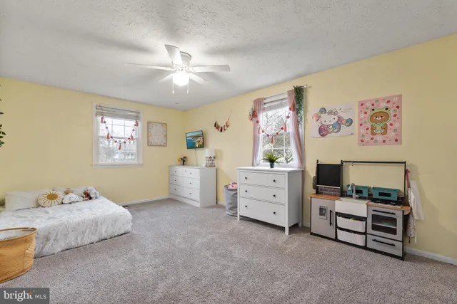a bedroom with furniture and window