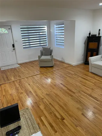 a bedroom with furniture and window