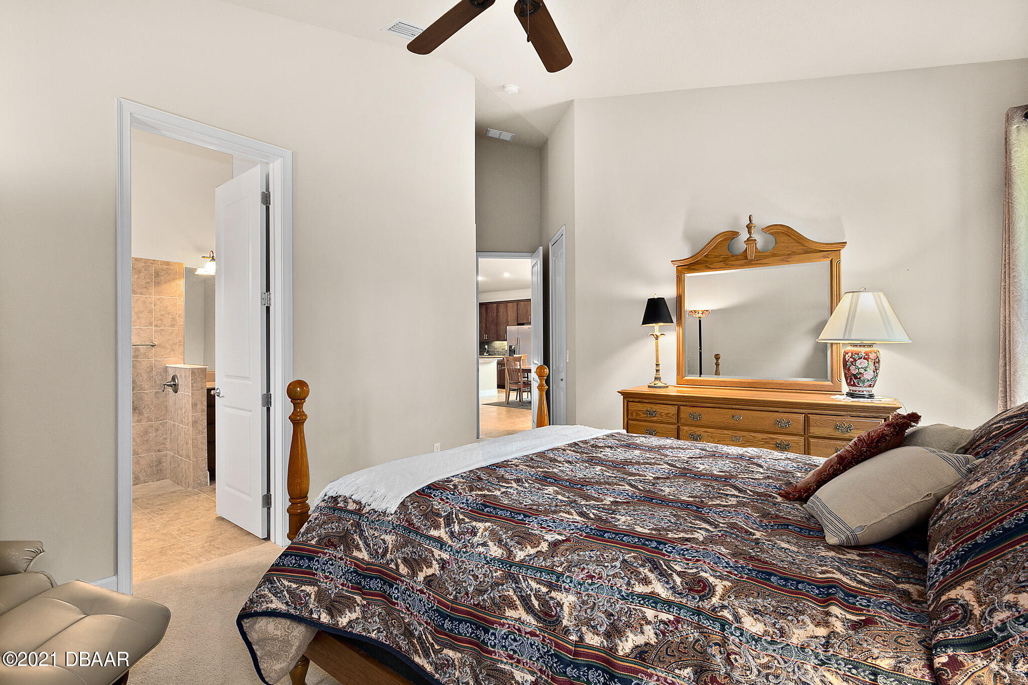 667 Elk River Drive Ormond Beach, FL 32174 - Photo 21 of 49 a bedroom with a bed and wooden floor