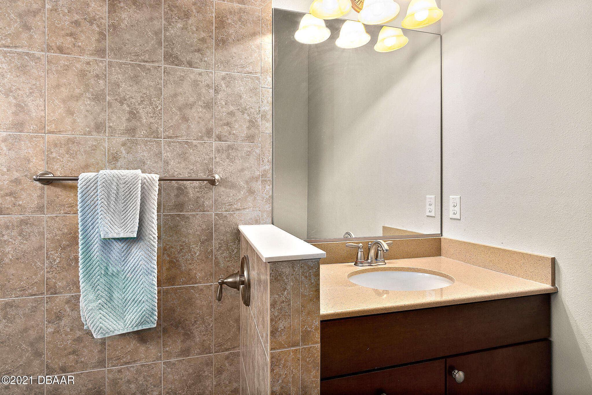 667 Elk River Drive Ormond Beach, FL 32174 - Photo 23 of 49 a bathroom with a sink and a mirror