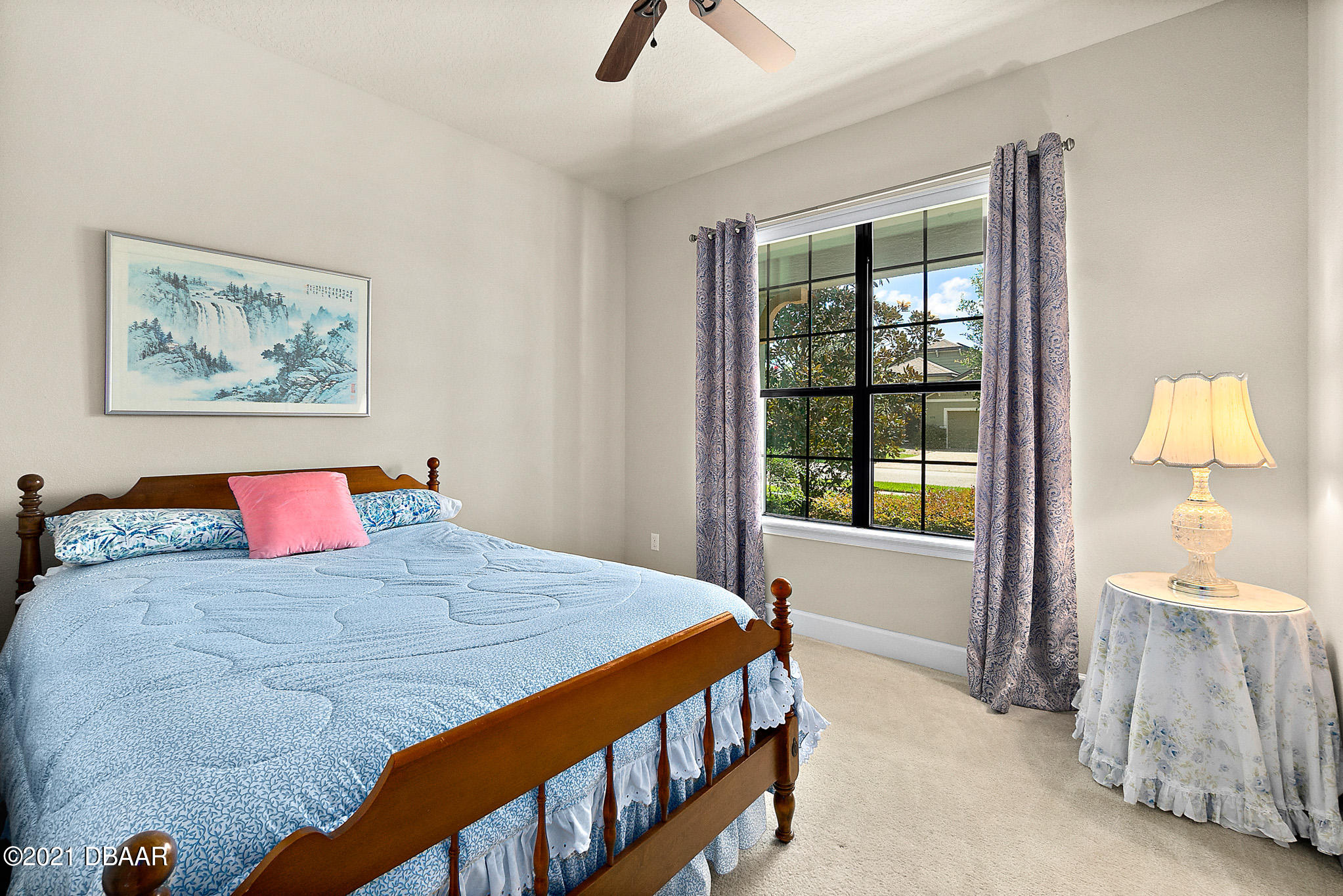 667 Elk River Drive Ormond Beach, FL 32174 - Photo 24 of 49 a bed sitting in a bedroom next to a window