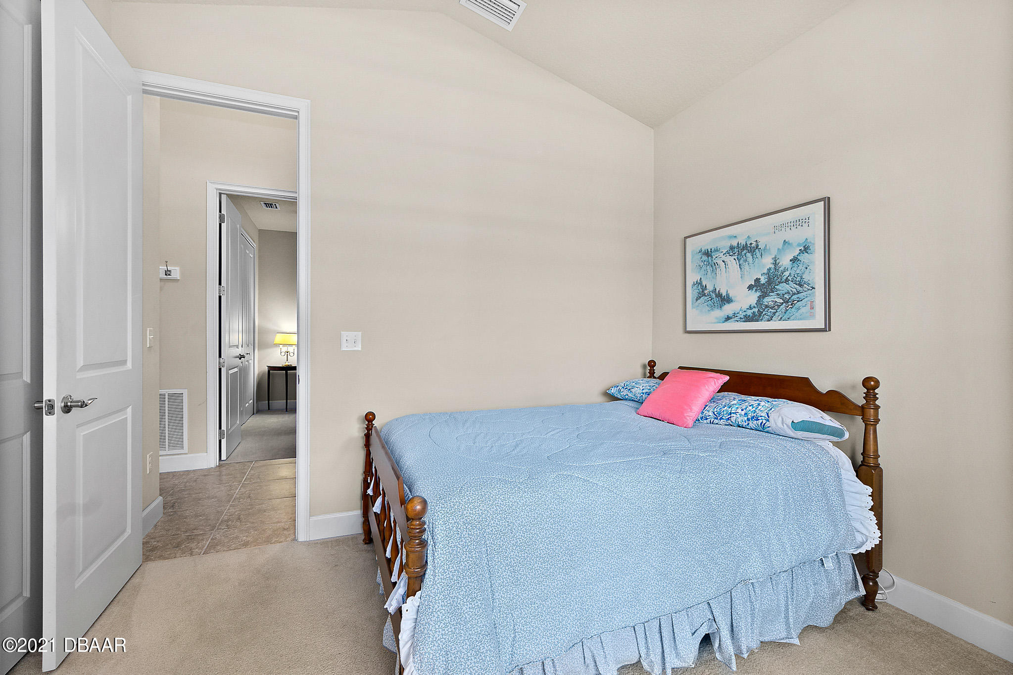 667 Elk River Drive Ormond Beach, FL 32174 - Photo 25 of 49 a bedroom with a bed and a painting on the wall
