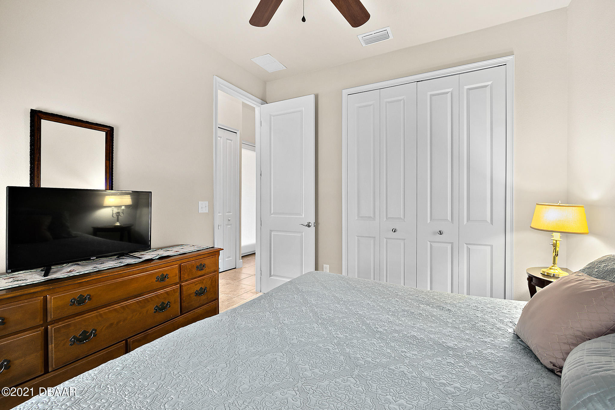 667 Elk River Drive Ormond Beach, FL 32174 - Photo 28 of 49 a living room with furniture and a flat screen tv