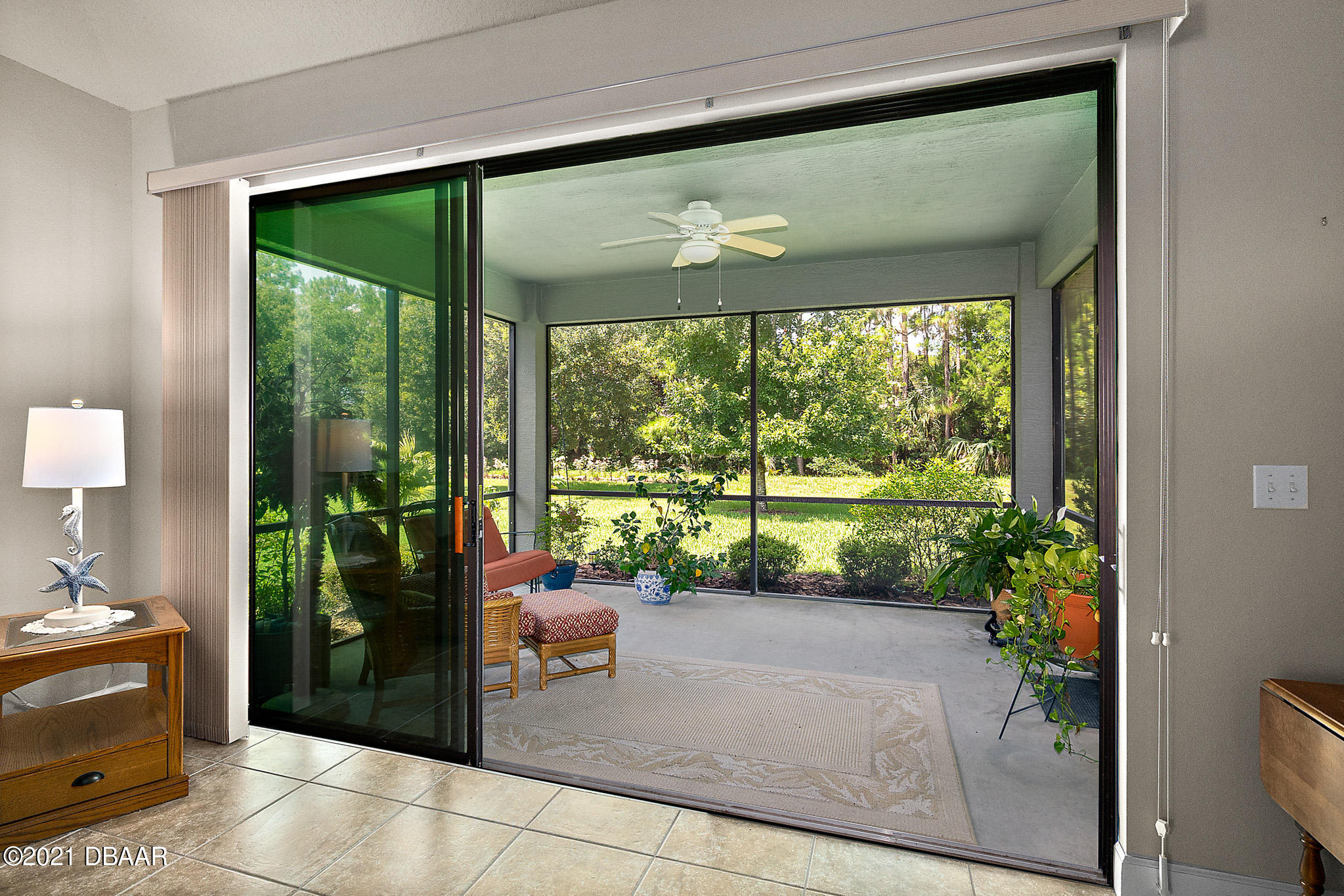 667 Elk River Drive Ormond Beach, FL 32174 - Photo 30 of 49 a living room with furniture and a large window