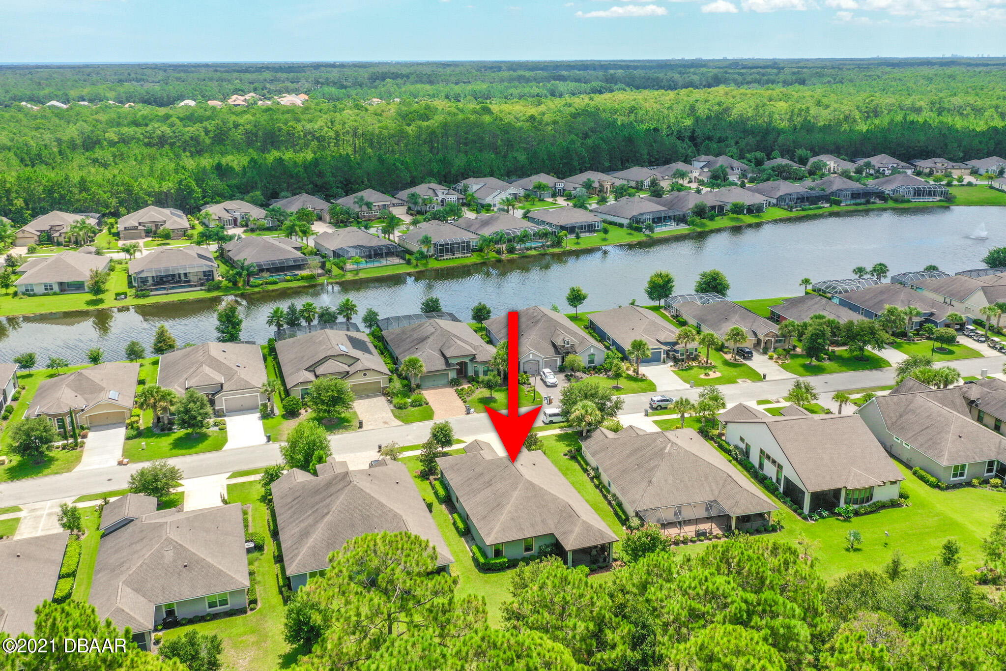 667 Elk River Drive Ormond Beach, FL 32174 - Photo 44 of 49 an aerial view of a houses with outdoor space and lake view