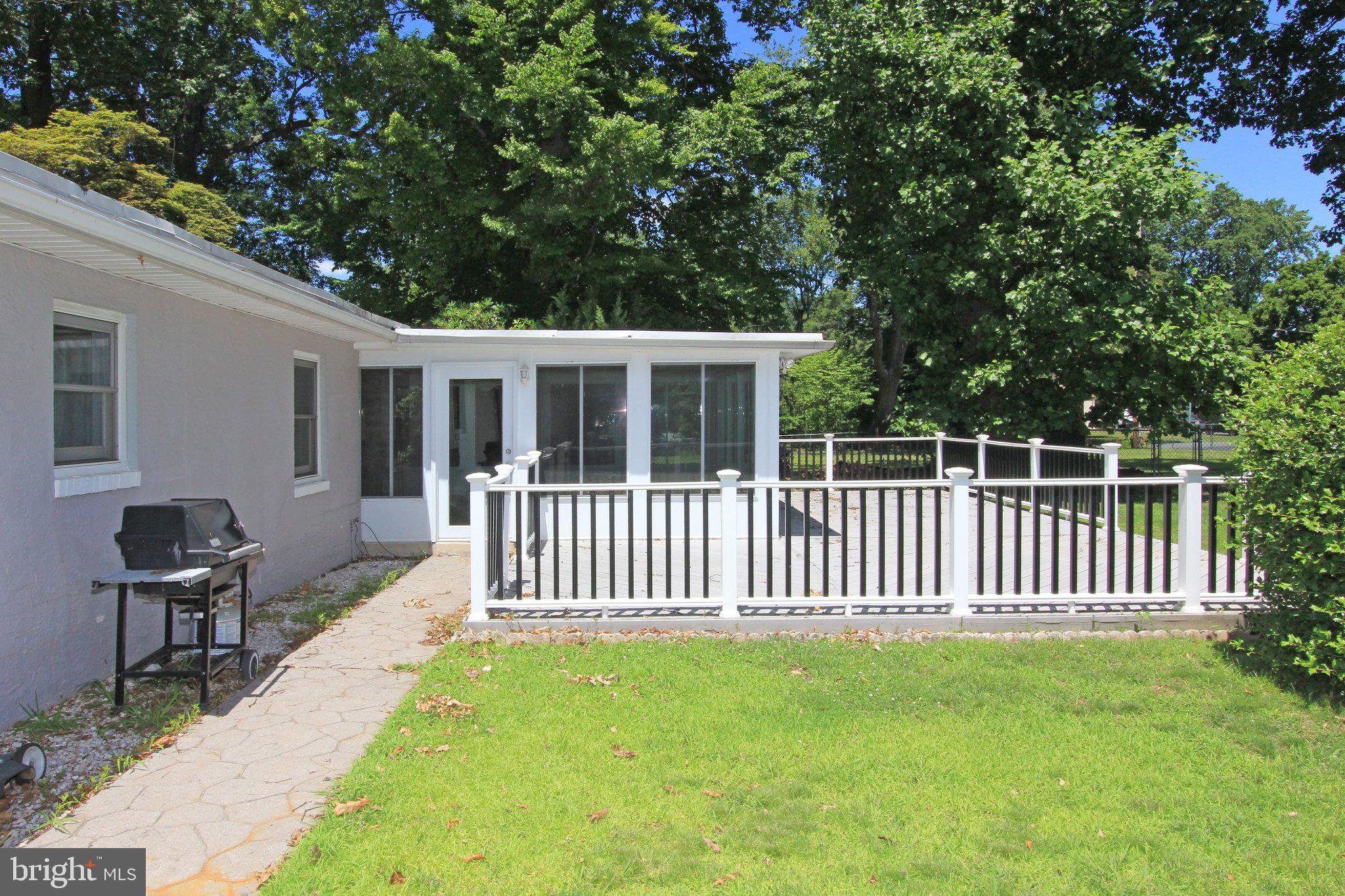 929 Cherry Tree Road Aston, PA 19014 - Photo 19 of 26 Charming patio retreat in lush greenery.