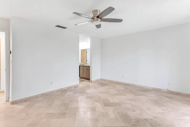 a view of a house with a yard and a garden