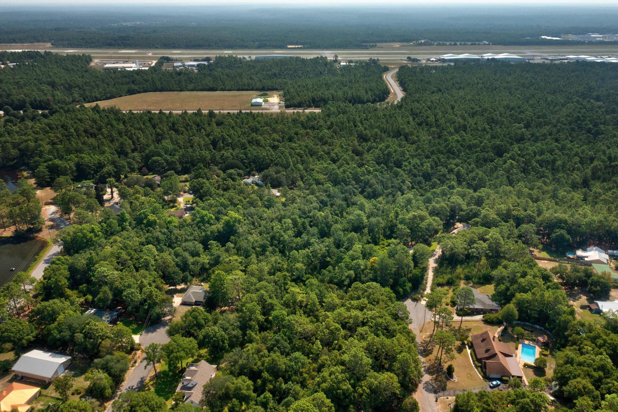 Tbd Wheeler Place Crestview, FL 32539 - Photo 9 of 15 an aerial view of residential houses with outdoor space and trees