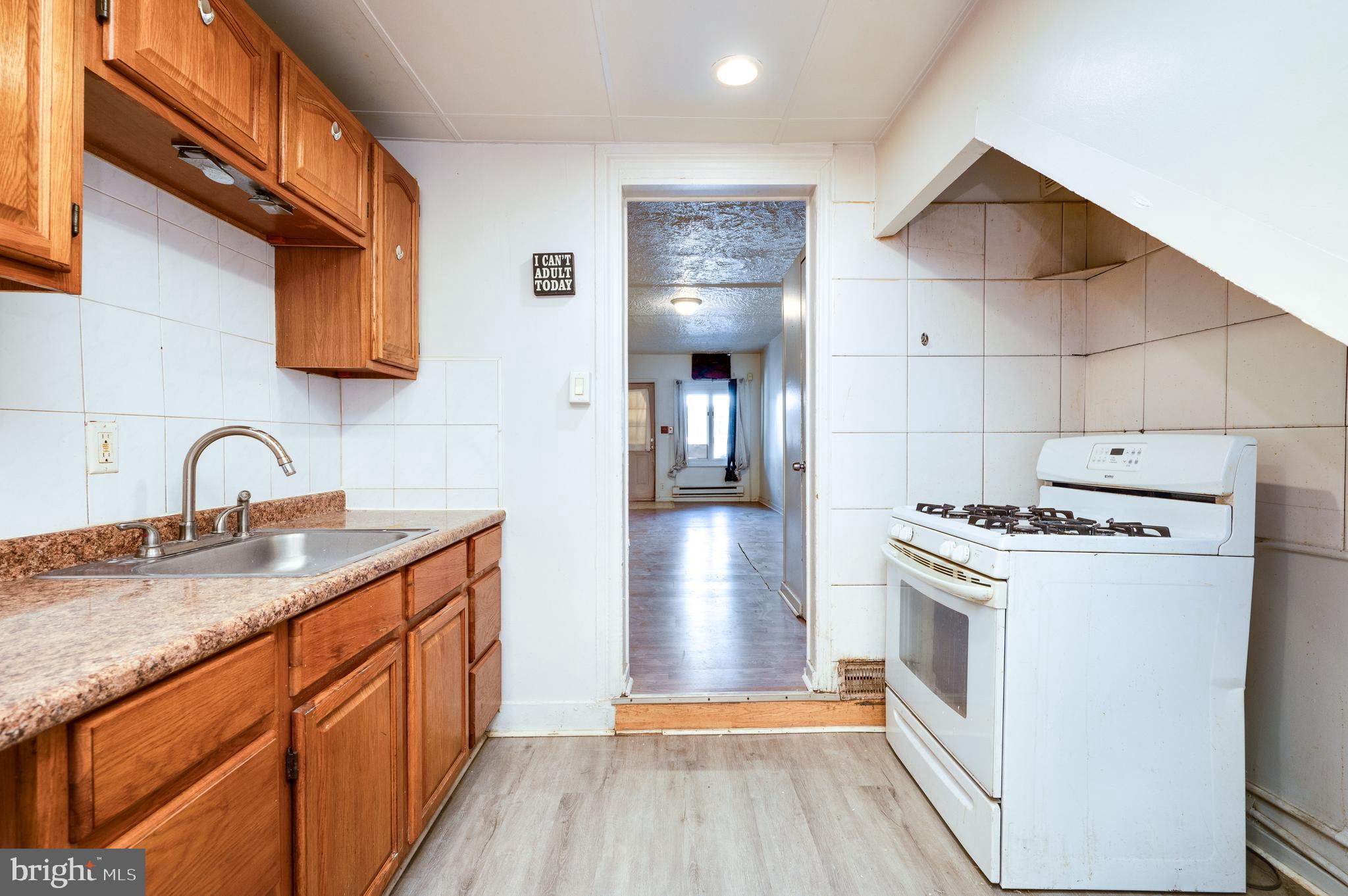 1022 Birch Street Reading, PA 19604 - Photo 13 of 32 a kitchen with a stove and a refrigerator
