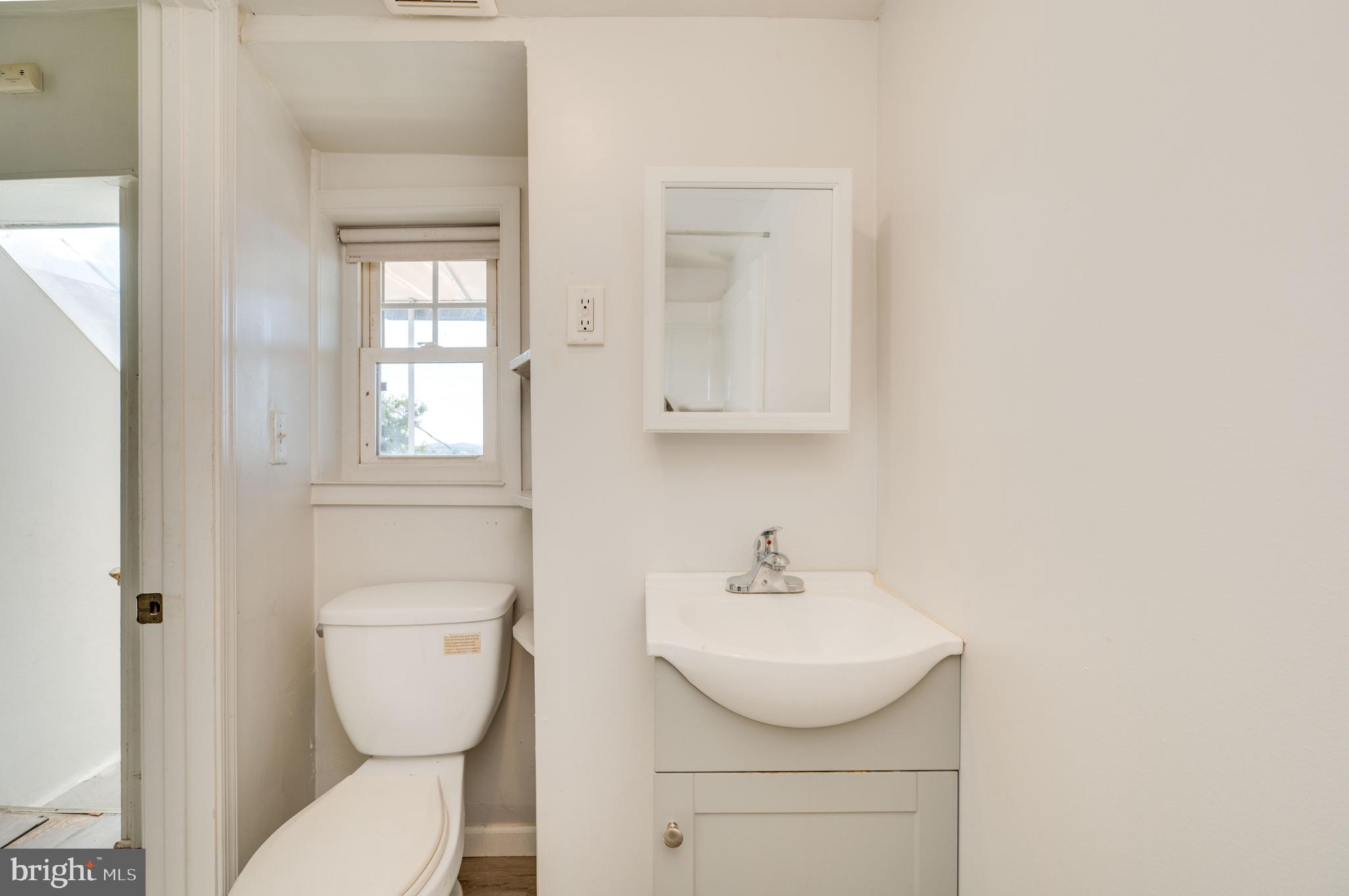 1022 Birch Street Reading, PA 19604 - Photo 15 of 32 a bathroom with a sink toilet and vanity