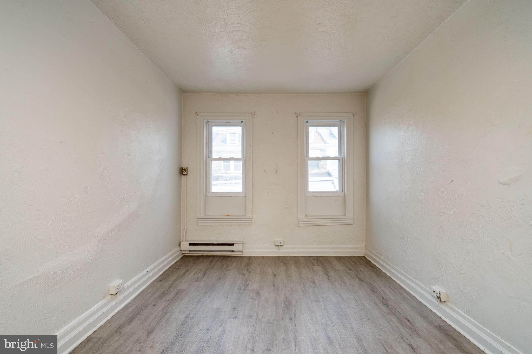 1022 Birch Street Reading, PA 19604 - Photo 18 of 32 an empty room with wooden floor and windows