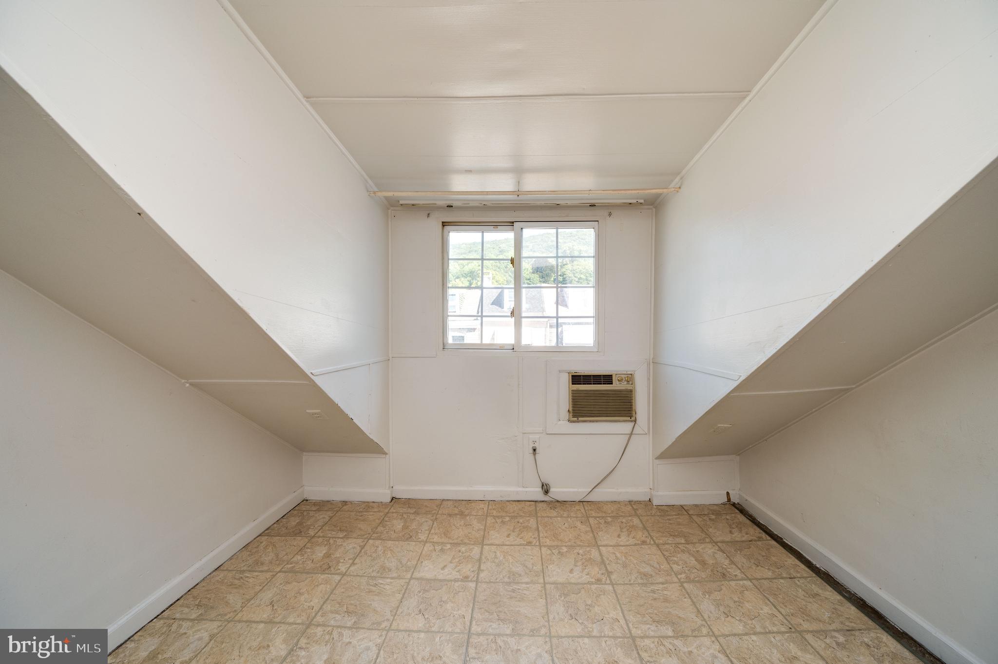 1022 Birch Street Reading, PA 19604 - Photo 19 of 32 a view of an empty room with a window