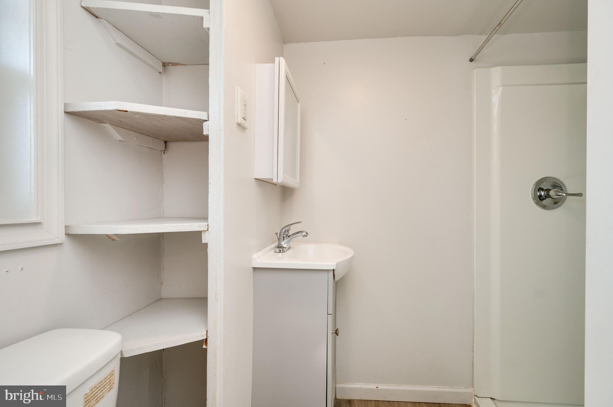 1022 Birch Street Reading, PA 19604 - Photo 2 of 32 a bathroom with a sink toilet and vanity