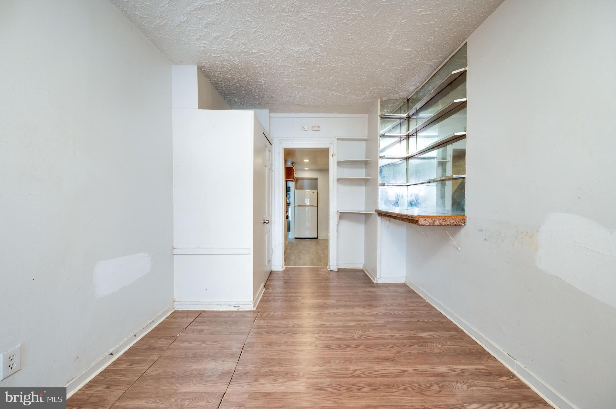 1022 Birch Street Reading, PA 19604 - Photo 4 of 32 a view of a hallway with wooden floor and closet