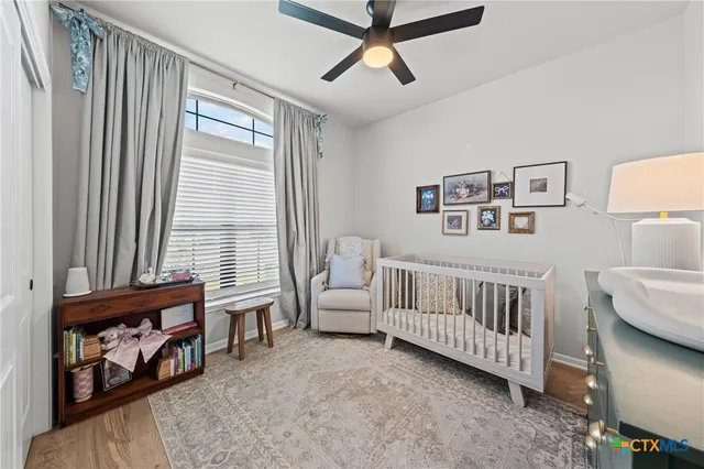 a bedroom with furniture and a window