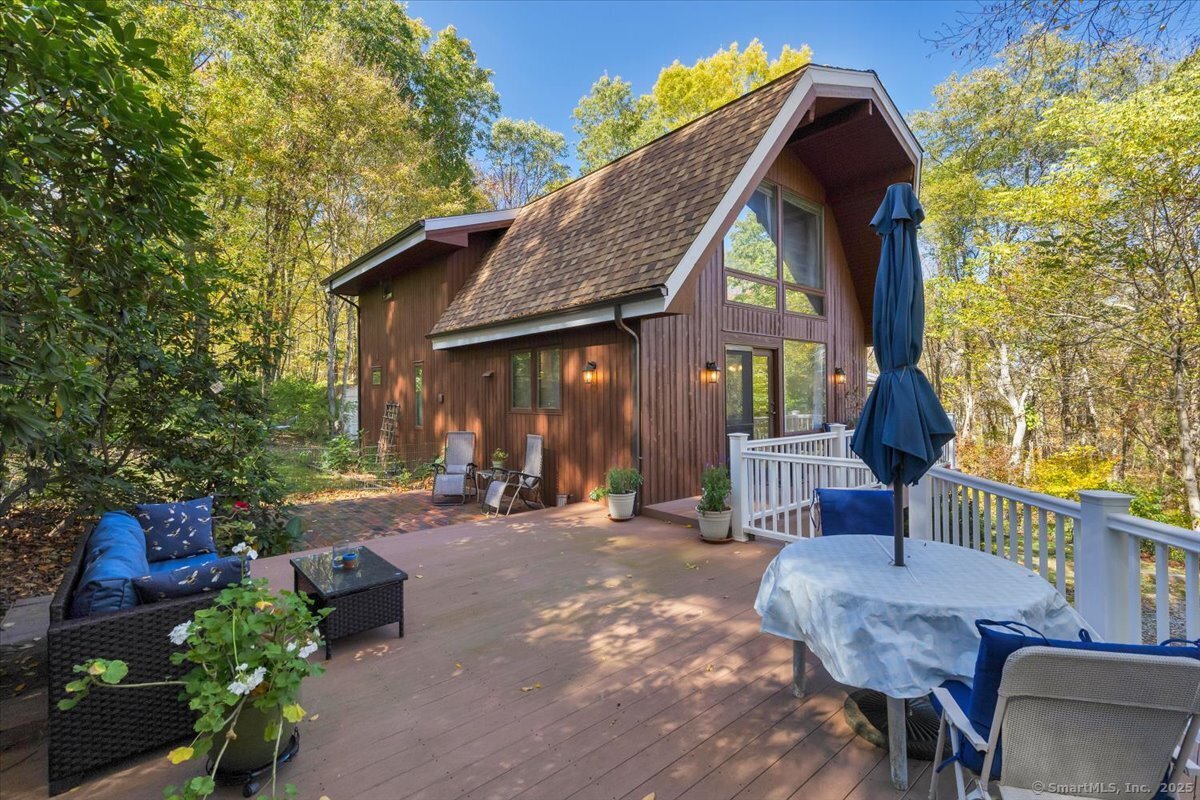 a view of a house with a chairs in patio