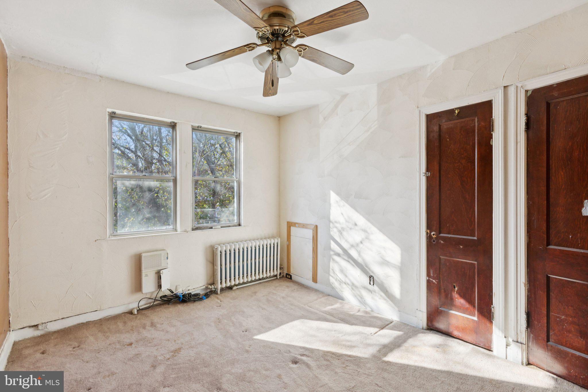 1633 R Street Southeast Washington, DC 20020 - Photo 14 of 44 an empty room with windows and fan