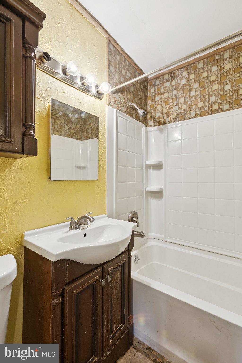 1633 R Street Southeast Washington, DC 20020 - Photo 18 of 44 a bathroom with a sink and a mirror