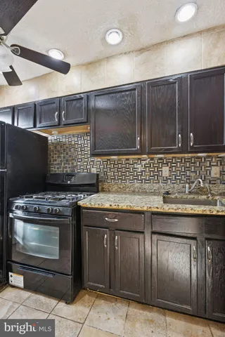 a toilet sitting in a bathroom next to a white wall
