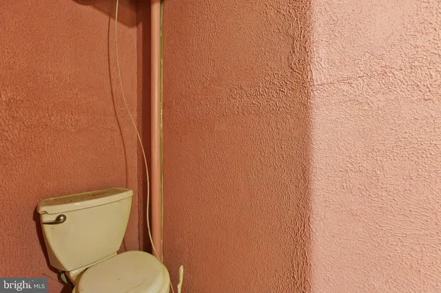 a view of empty room with wooden walls