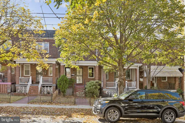 front view of a house with a tree