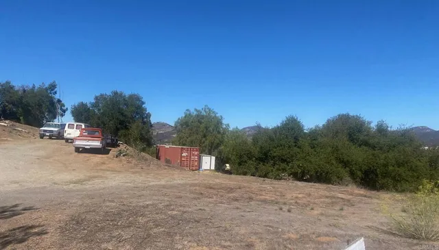 a view of a outdoor space with deck and yard