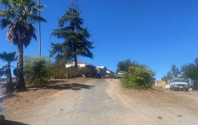 a picture of a houses with a yard