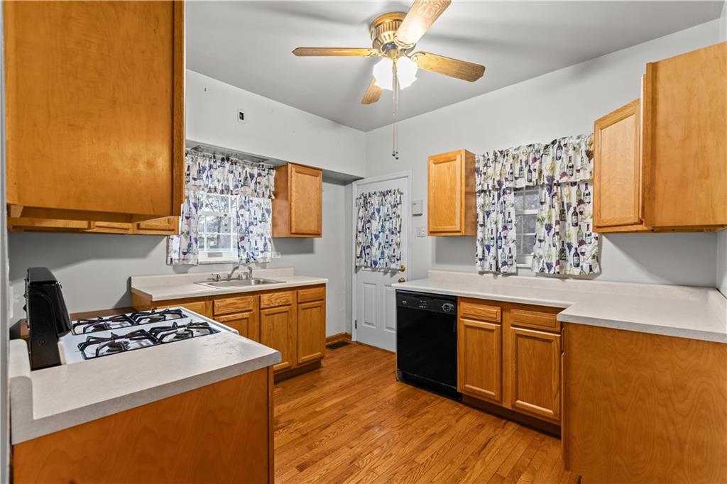 109 Helen Street McKees Rocks, PA 15136 - Photo 16 of 31 a kitchen with stainless steel appliances a stove a sink and a refrigerator