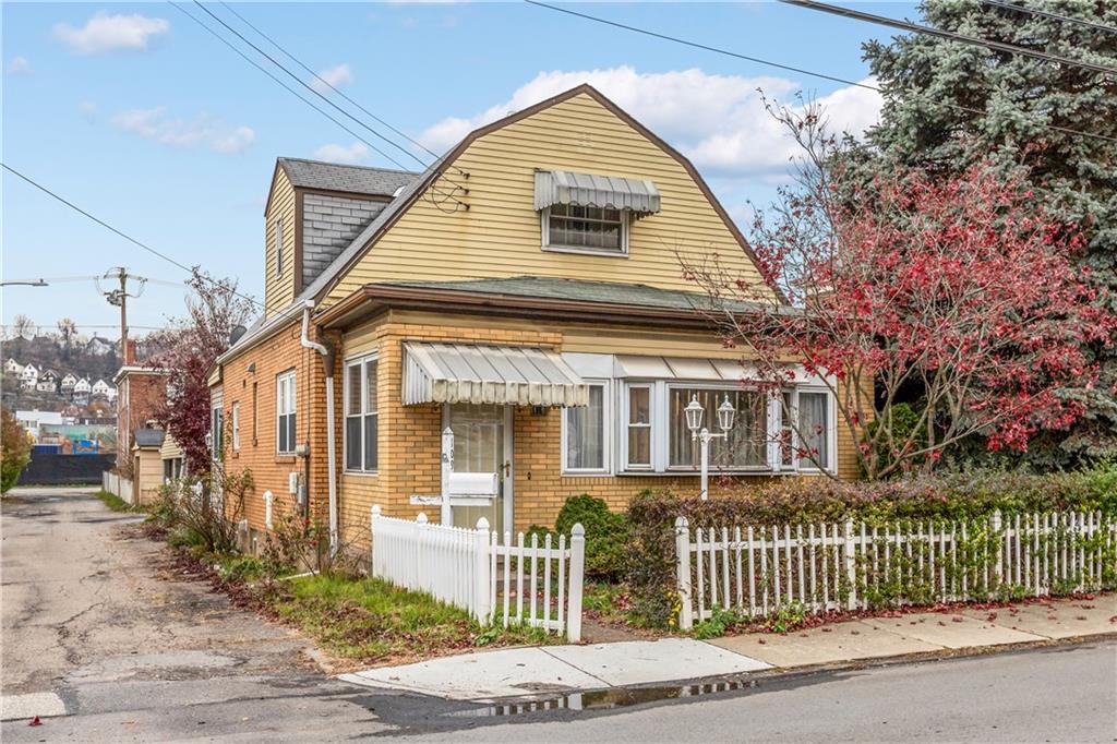109 Helen Street McKees Rocks, PA 15136 - Photo 2 of 31 a front view of a house with a yard