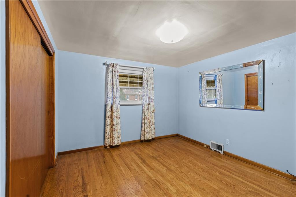 109 Helen Street McKees Rocks, PA 15136 - Photo 24 of 31 a view of empty room with wooden floor and fan