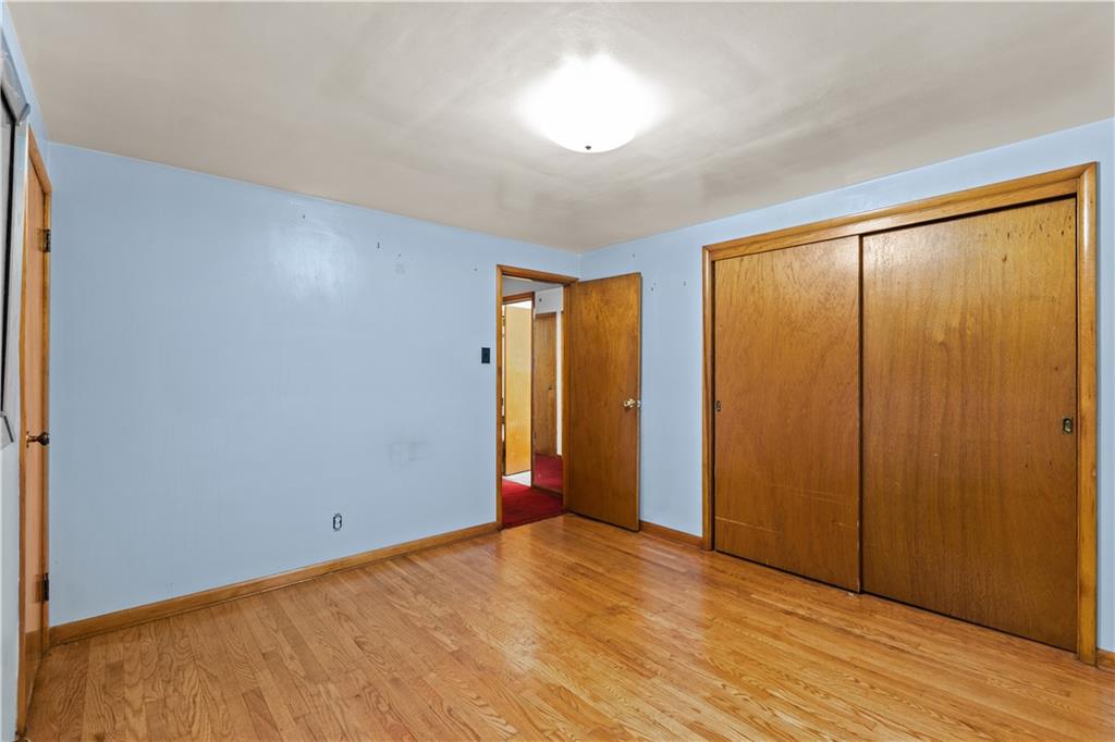 109 Helen Street McKees Rocks, PA 15136 - Photo 25 of 31 a view of an empty room with wooden floor and a window