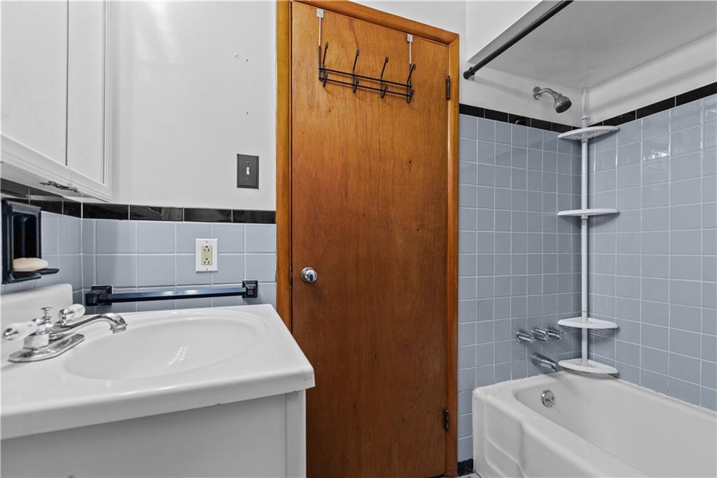 109 Helen Street McKees Rocks, PA 15136 - Photo 28 of 31 a bathroom with a sink and a tub