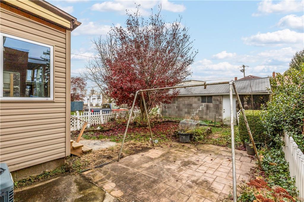 109 Helen Street McKees Rocks, PA 15136 - Photo 4 of 31 a view of a chair and table in backyard of the house