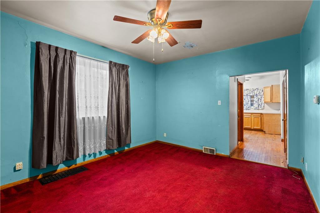 109 Helen Street McKees Rocks, PA 15136 - Photo 9 of 31 an empty room with windows and closet