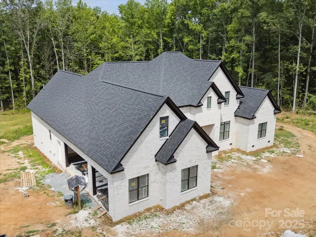 a aerial view of a house with a yard